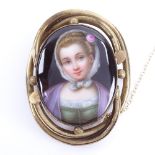 A 19th century miniature hand painted watercolour portrait on porcelain brooch, depicting a young