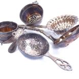 A group of Continental silver tea strainers and sifting spoons, including Danish and German