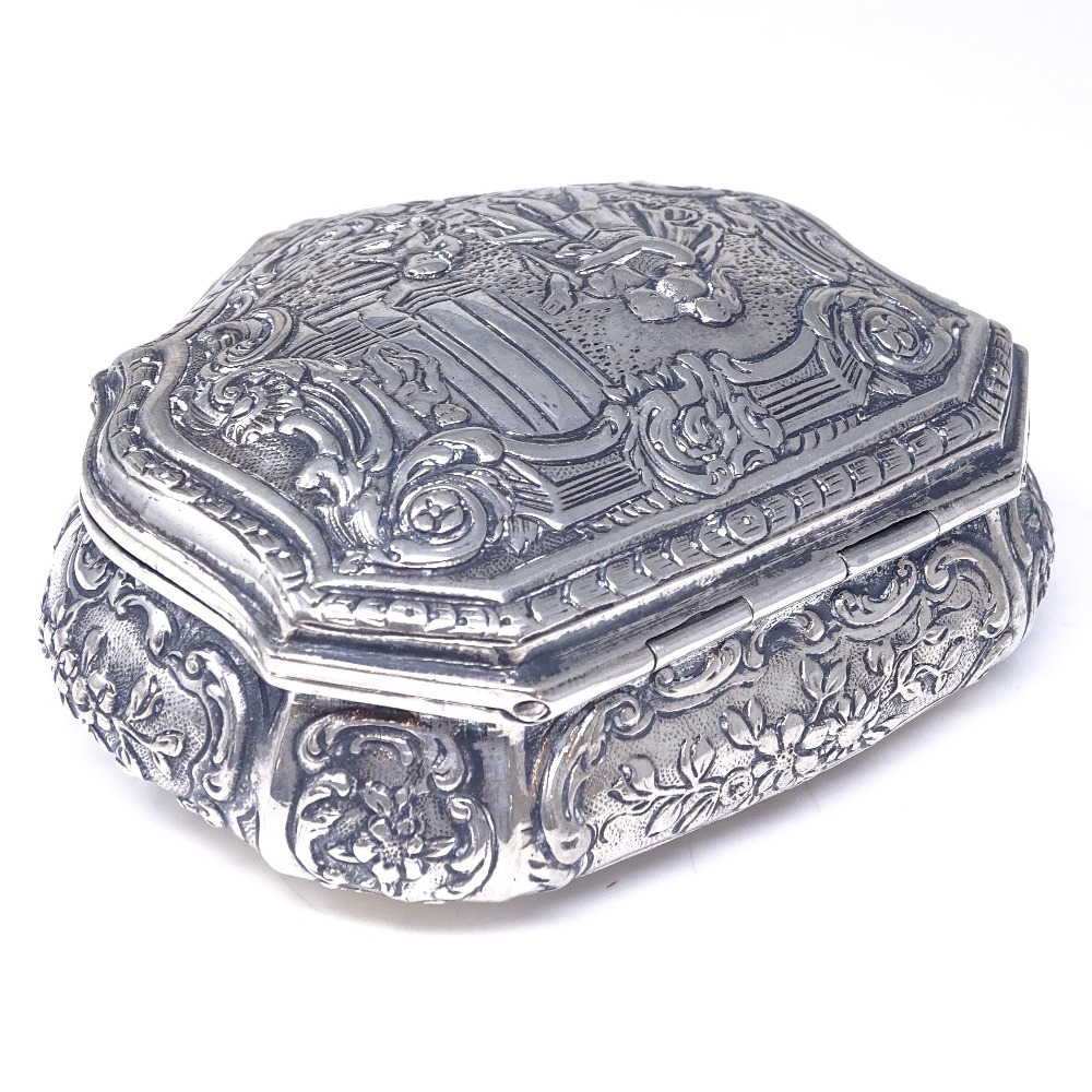 A 19th century German Hanau silver snuff box, shaped cartouche form with relief embossed classical - Image 2 of 4