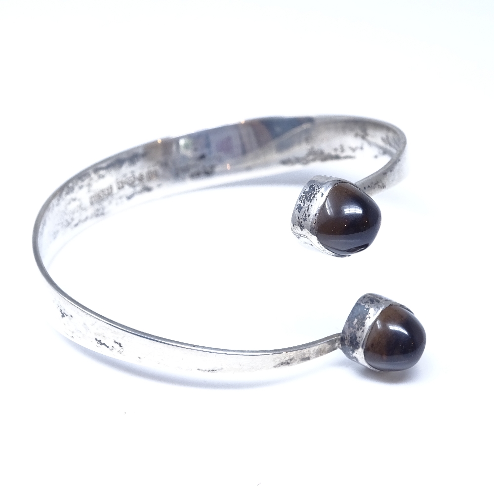 A Gert Thysell for Gussi Swedish silver and smoky quartz modernist torque bangle, each terminal - Image 2 of 5