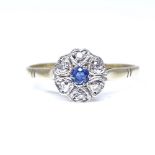 An 18ct gold sapphire and diamond cluster flowerhead ring, set with round sapphire and round