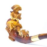A 19th century Meerschaum pipe, formed as a lady sitting with a Yorkshire Terrier dog, amber