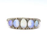 A 9ct gold opal and diamond half hoop ring, set with graduated cabochon opals and modern single-