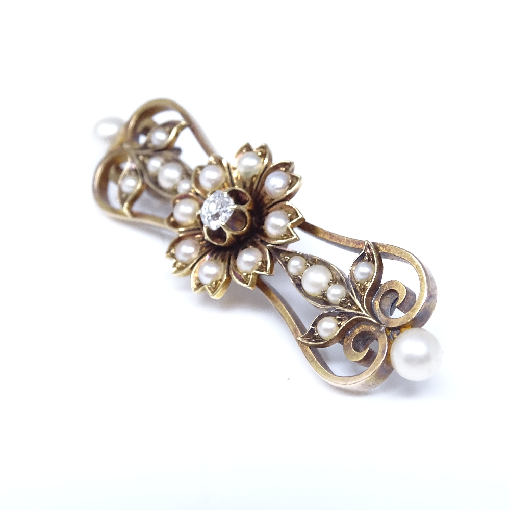 A Victorian unmarked gold pearl and diamond floral brooch, set with whole pearls, split pearls and - Image 2 of 4