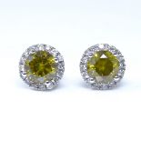 A pair of 14ct white gold 1.88ct fancy greyish yellow cluster earrings, with stud fittings, each