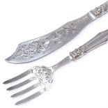 A Victorian silver fish serving set, pierced silver blades with relief embossed foliate handles,