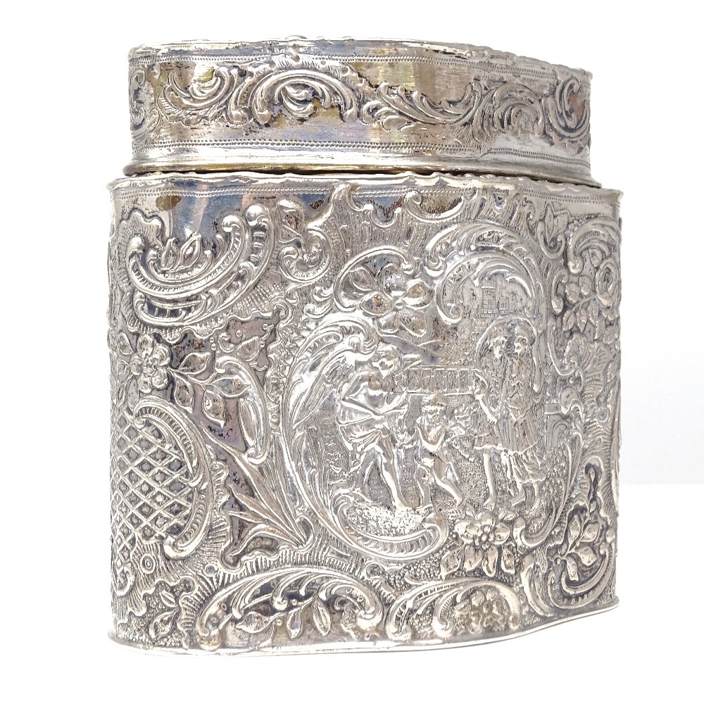 A Continental silver tea caddy, shaped oval form with relief embossed lover scenes within a - Image 3 of 4