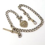 A silver-gilt graduated curb-link Albert chain, with Tiffany & Co Return heart tag, dog clip and T-