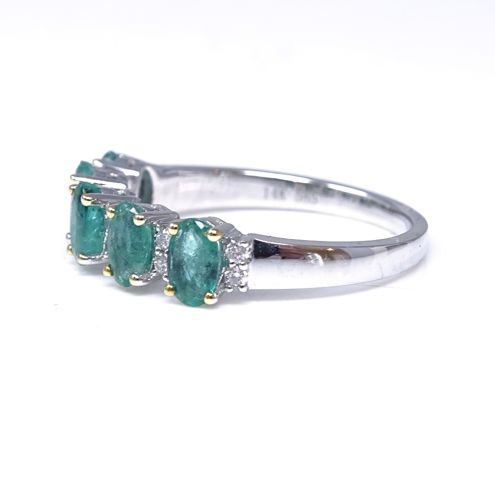 A 14ct white gold emerald and diamond half-hoop ring, total oval-cut emerald content approx 1. - Image 2 of 5