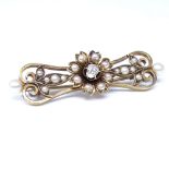 A Victorian unmarked gold pearl and diamond floral brooch, set with whole pearls, split pearls and