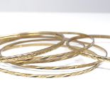 6 9ct gold slave bangles, engraved geometric decoration, largest band width 2.6mm, internal