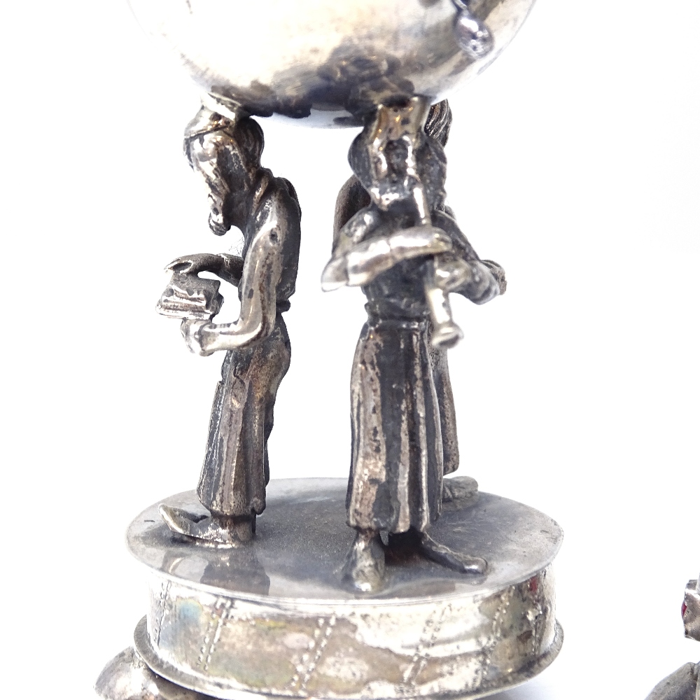 A pair of Russian silver Judaica besamim spice boxes, stone-set lids supported by rabbi figures, - Image 3 of 6