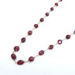 An unmarked gold oval-cut rose garnet line necklace, necklace length 52cm, 7.7g Very good original