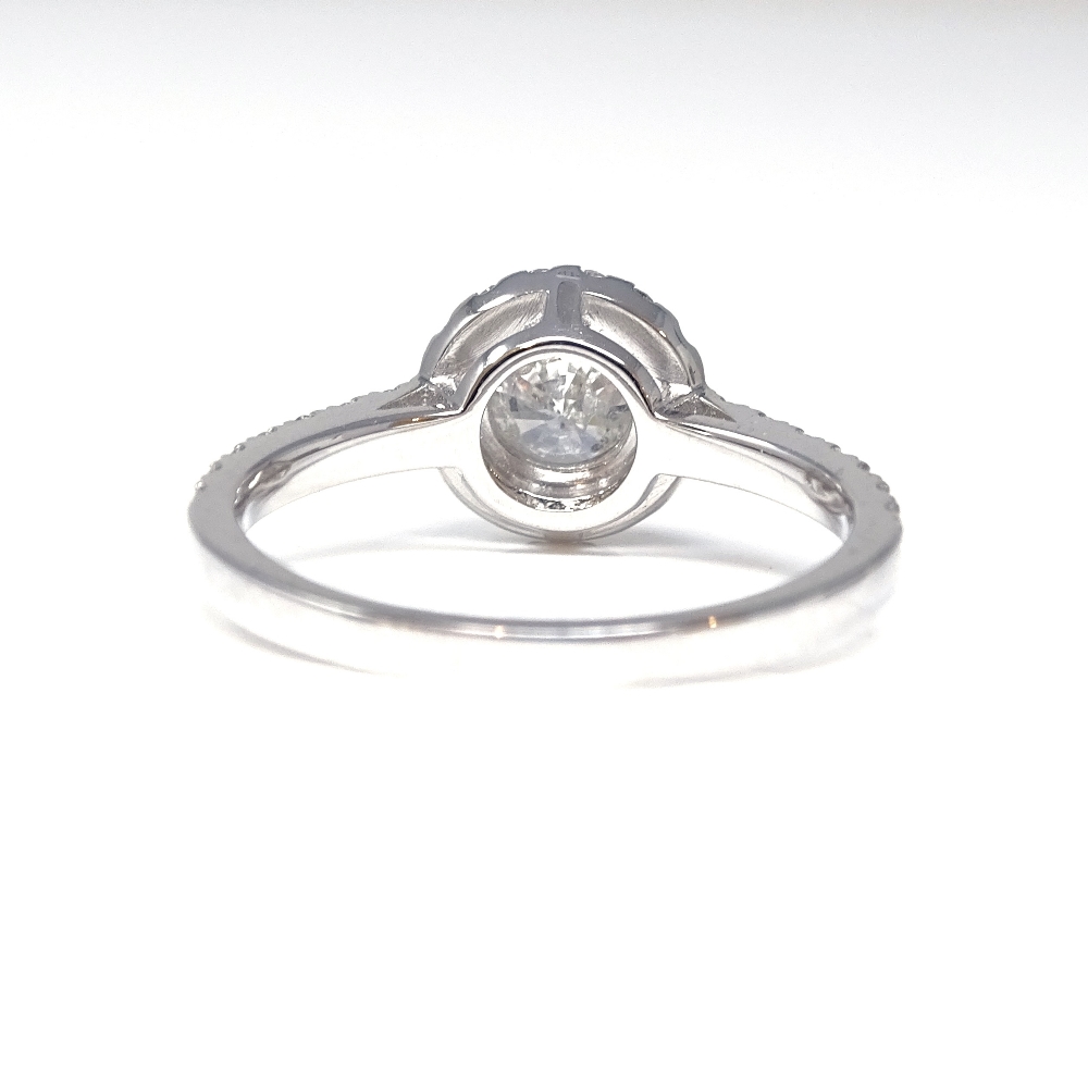 A 14ct white gold diamond halo cluster ring, with diamond set shoulders and pierced bridge, - Image 3 of 5