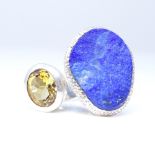 A modern sterling silver lapis lazuli and citrine abstract ring, set with rough cut lapis and oval