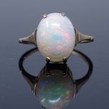 An unmarked gold cabochon opal dress ring, opal length 12mm, size L, 2g (shank split) Good overall