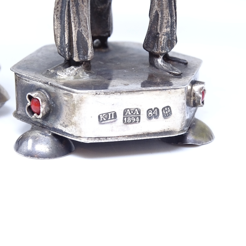 A pair of Russian silver Judaica besamim spice boxes, stone-set lids supported by rabbi figures, - Image 5 of 6