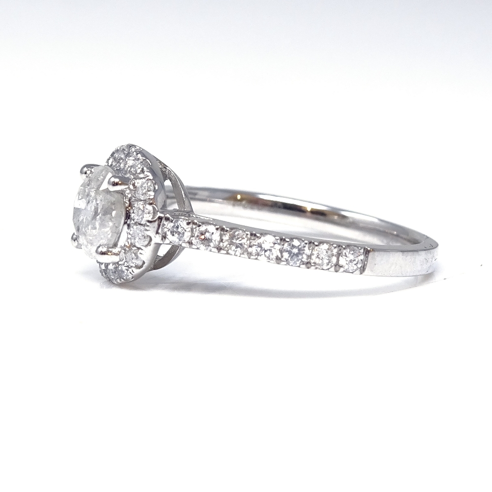 A 14ct white gold diamond halo cluster ring, with diamond set shoulders and pierced bridge, - Image 2 of 5