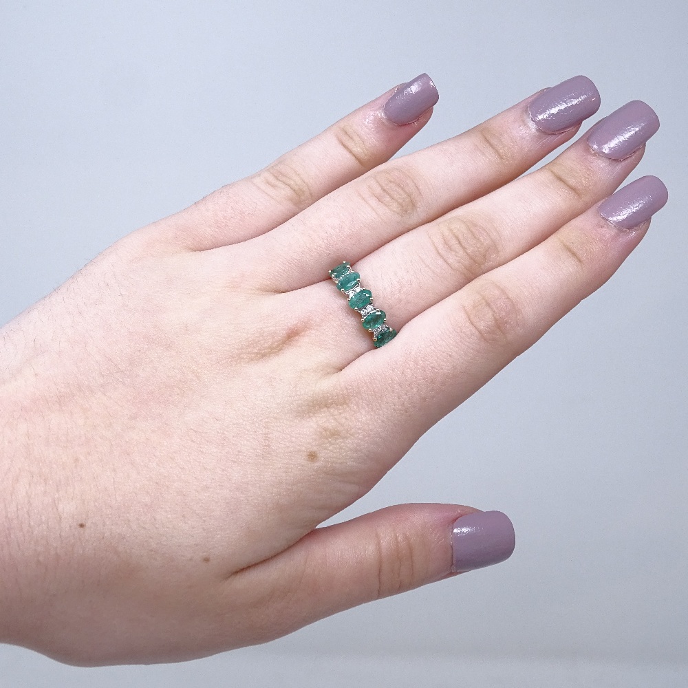 A 14ct white gold emerald and diamond half-hoop ring, total oval-cut emerald content approx 1. - Image 4 of 5