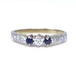 A 9ct gold 3-stone sapphire and diamond ring, set with round brilliant cut central diamond, round