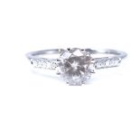 A 14ct white gold 1.01ct solitaire champagne diamond ring, with diamond set shoulders and lozenge