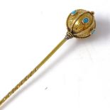 A Victorian unmarked gold turquoise orb stick pin, ropetwist straps with floral engraved