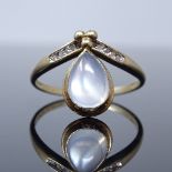A 9ct gold moonstone and diamond wishbone ring, set with pear-cut cabochon moonstone and modern