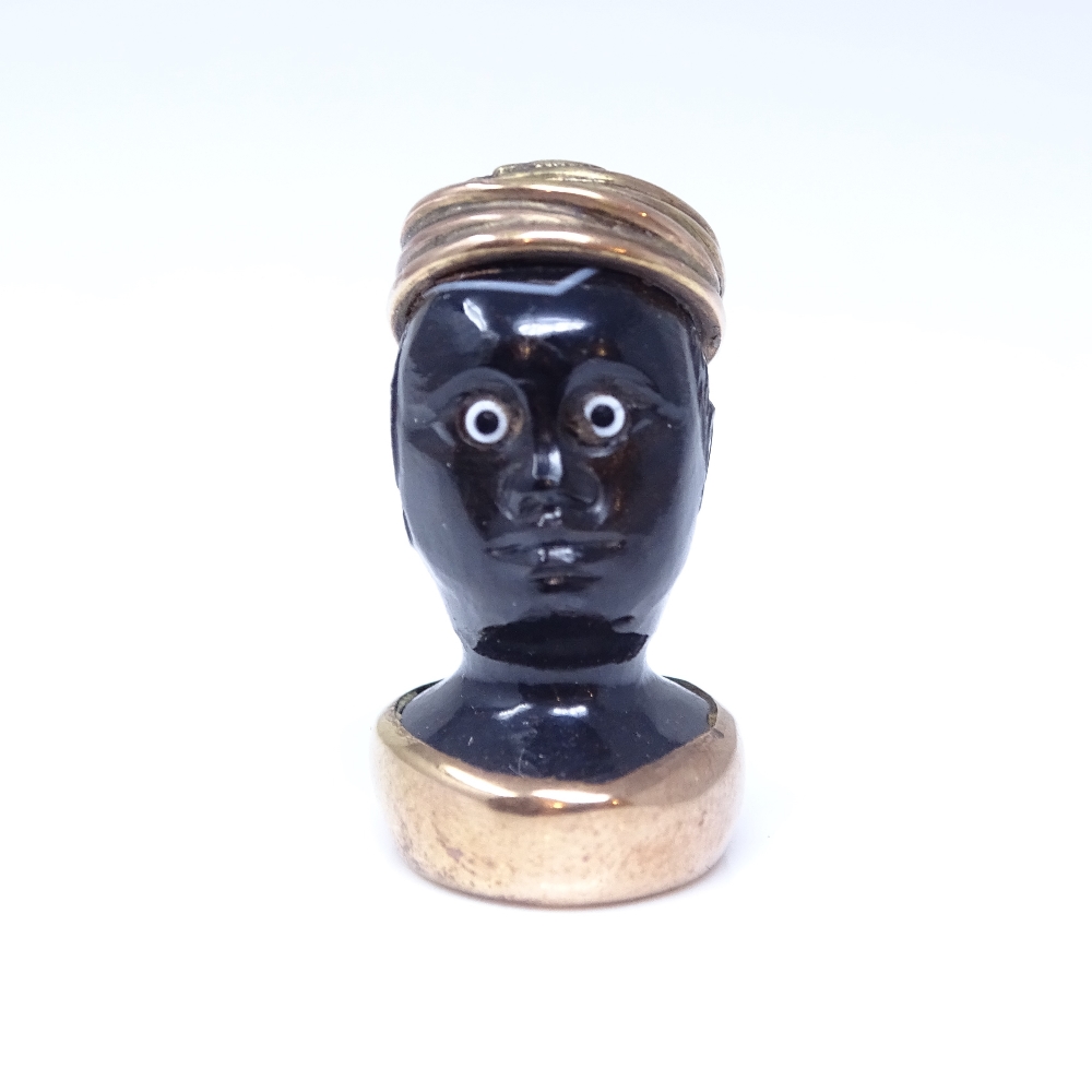 A 19th century banded agate figural Blackamoor seal fob, unmarked rose gold mounts with cabochon - Image 3 of 5