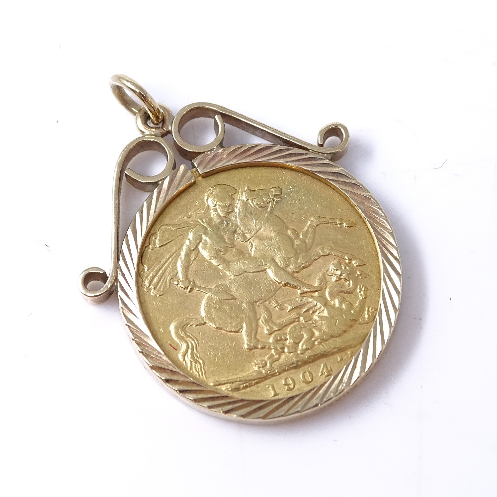 An Edward VII 1904 gold sovereign, in 9ct pendant mount, 10.8g gross Good condition, general surface
