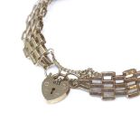 A 9ct gold gatelink heart padlock bracelet, maker's marks LC, hallmarks London 1983, bracelet length