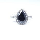 A 14ct white gold black and colourless diamond cluster ring, pear-cut black diamond approx 2.09ct,