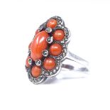 A mid-20th century Continental silver coral and marcasite panel dress ring, setting height 21.8mm,