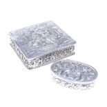 A German silver pill box and a Swedish silver pill box, both with relief embossed decoration and