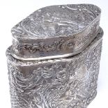 A Continental silver tea caddy, shaped oval form with relief embossed lover scenes within a