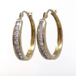 A pair of 9ct gold 0.5ct diamond hoop earrings, each earring diamond content approx 0.25ct,