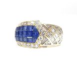 An 18ct gold sapphire and diamond buckle ring, set with calibre-cut sapphires and princess