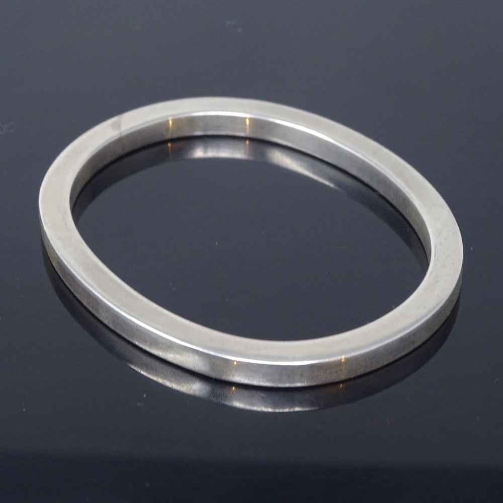 BENT OVEGAARD HANSEN - a Danish sterling silver modernist slave bangle, plain oval heavy gauge form, - Image 2 of 5