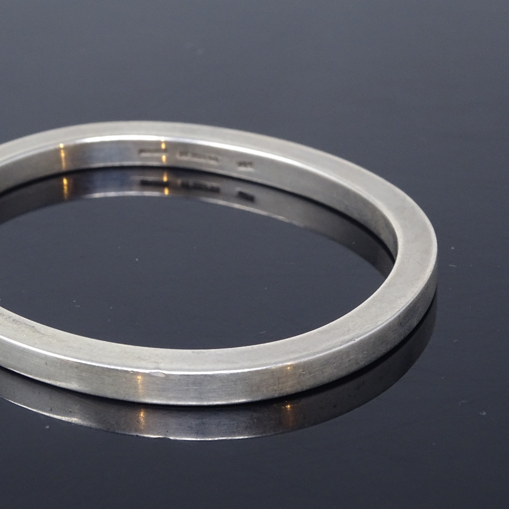 BENT OVEGAARD HANSEN - a Danish sterling silver modernist slave bangle, plain oval heavy gauge form, - Image 3 of 5