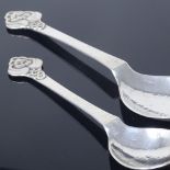 EVALD NIELSEN - a graduated pair of Art Nouveau Danish silver spoons, relief floral terminals with
