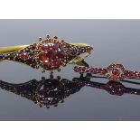 A Victorian gilt-metal and garnet cluster matching hinged bangle and bar brooch set, set with rose-