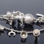 C A CHRISTENSENS - a Danish silver heavy gauge charm bracelet with lion and football charms,