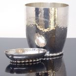 EVALD NIELSEN - an early 20th century Danish silver stylised matching beaker and pin tray, planished