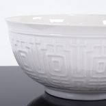 ROYAL COPENHAGEN - a Mid-Century Danish white porcelain Blanc-de-Chine bowl, underglaze Oriental