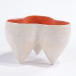 DEANA MOORE (British) - a Studio Pottery earthenware tripod pot, orange and white glaze, impressed