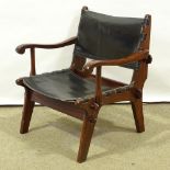 ANGEL PAZMINO - a Mid-Century Ecuadorian rosewood stained teak lounge chair, leather sling seat