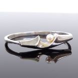 A Danish modernist stylised sterling silver and whole pearl hinged bangle, indistinct maker's