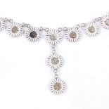 A Danish stylised sterling silver and white enamel Daisy drop necklace, on sterling chain, daisy