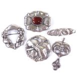 4 Art Nouveau Scandinavian silver and white metal floral brooches and a pendant, makers include