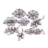 9 Danish stylised silver floral dome brooches, makers include Hermann Siersbol, largest length 56.