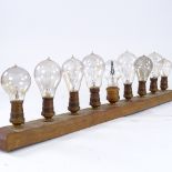 WITHDRAWN Strip of 9 fine filament early light bulbs, including Masonic filament light bulb in